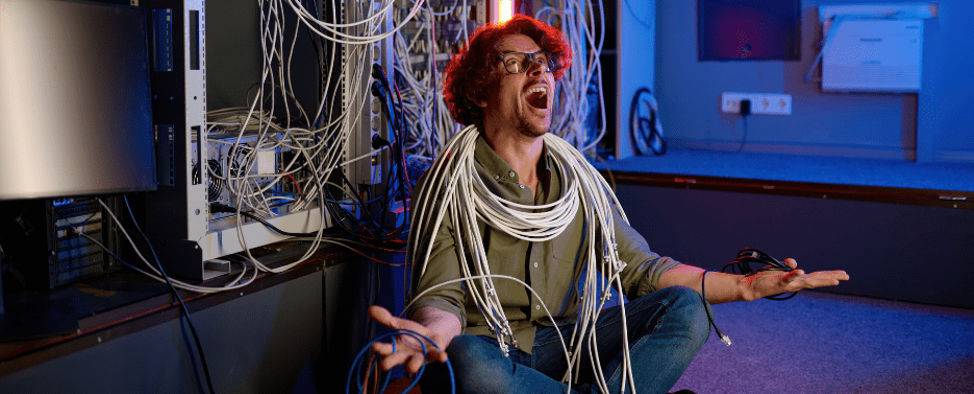 An IT technician feeling frustrated and overwhelmed by data center issues, including cost, maintenance, and technical problems.