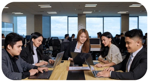 TRT Employees engaged in teamwork around a laptop, dedicated to improving service quality and customized service level agreements.